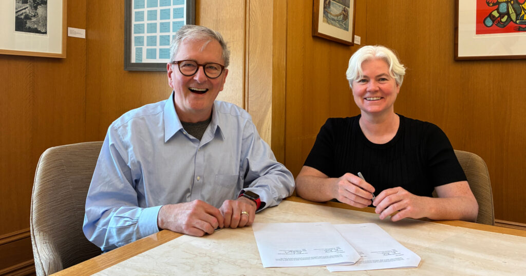 Western University leaders travelled to Halifax to sign a new agreement with Dalhousie University. (L to R) Western President Alan Shepard and Dalhousie President Kim Brooks formalize the new partnership with a memorandum of understanding.